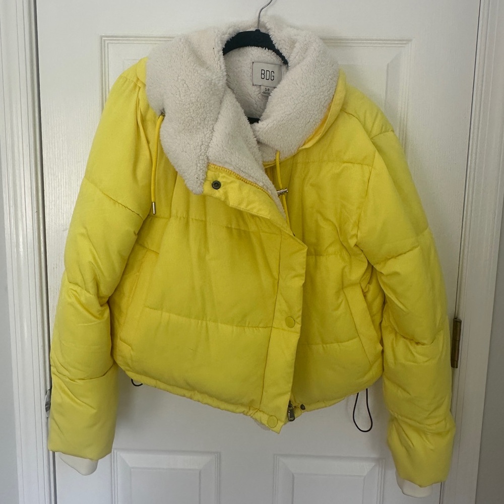 Bright yellow puffer jacket with sherpa lining
